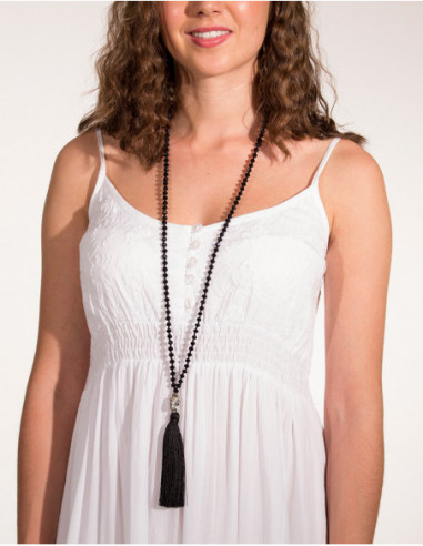 Long necklace of pearls and Buddha head