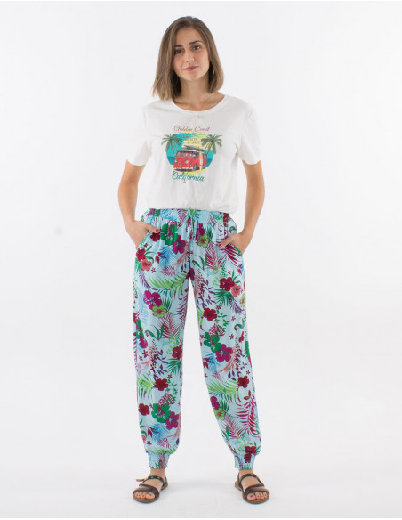 Pantalon femme léger resserré aux chevilles turquoise imprimé fleurs colorées estivales