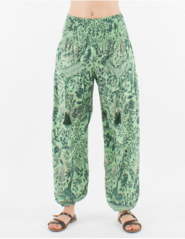 Pantalon femme style Aladin baba cool resserré aux chevilles imprimé fleurs et feuilles bleu turquoise