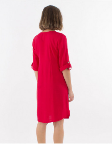 Women's dress with 3/4 sleeves with lapels and buttons in front of solid red