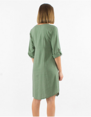 Women's dress with 3/4 sleeves with lapels and buttons in front of solid water green