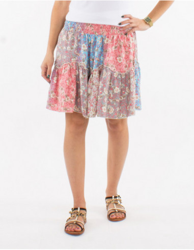 Short flared skirt with bohemian chic ruffle for summer in salmon pink pastel floral print