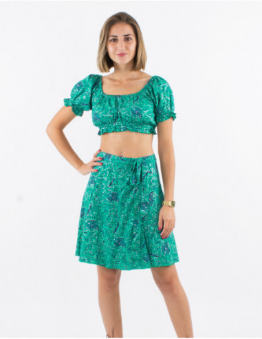 Original summer look with elastic bra and short silver skirt in mint green