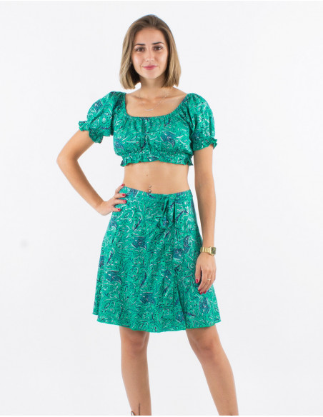 Original summer look with elastic bra and short silver skirt in mint green