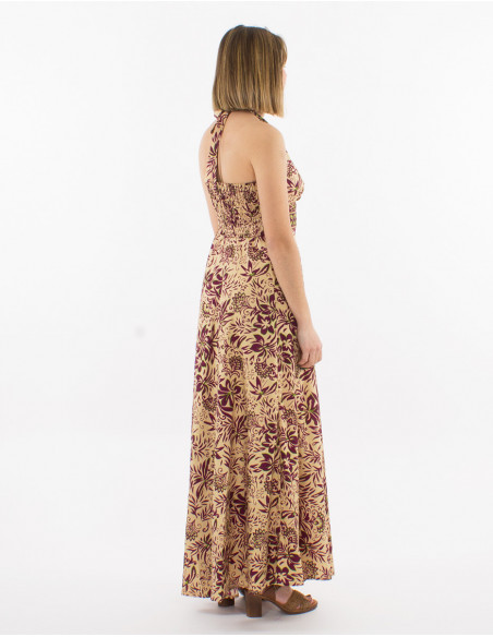 Long flowing summer dress with halter neck and beige floral pattern