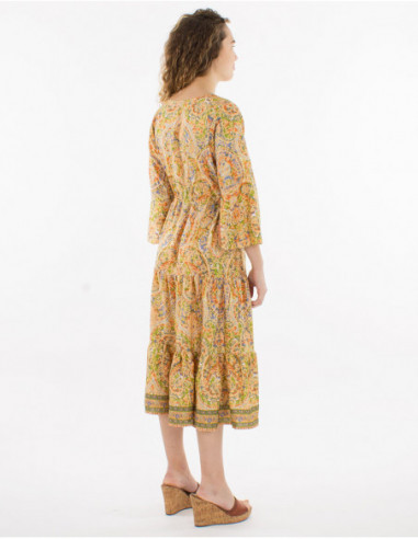Back of original women's midi dress with tassels and peach beige paisley