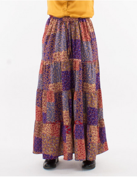 Original ruffled long skirt for fall 2023 with patchwork pattern in shades of pink and purple