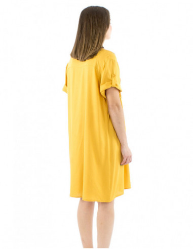 Large fluid dress gathers and buttons