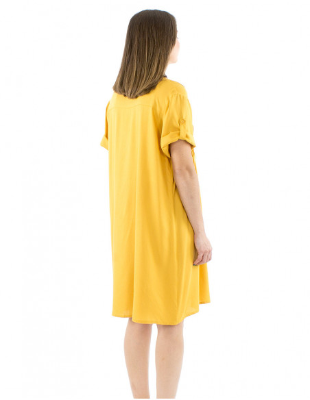 Large fluid dress gathers and buttons